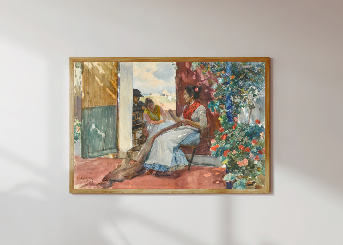 Framed art print of Mending the Nets by Joaquín Sorolla, in a light wood frame on a sunlit white wall