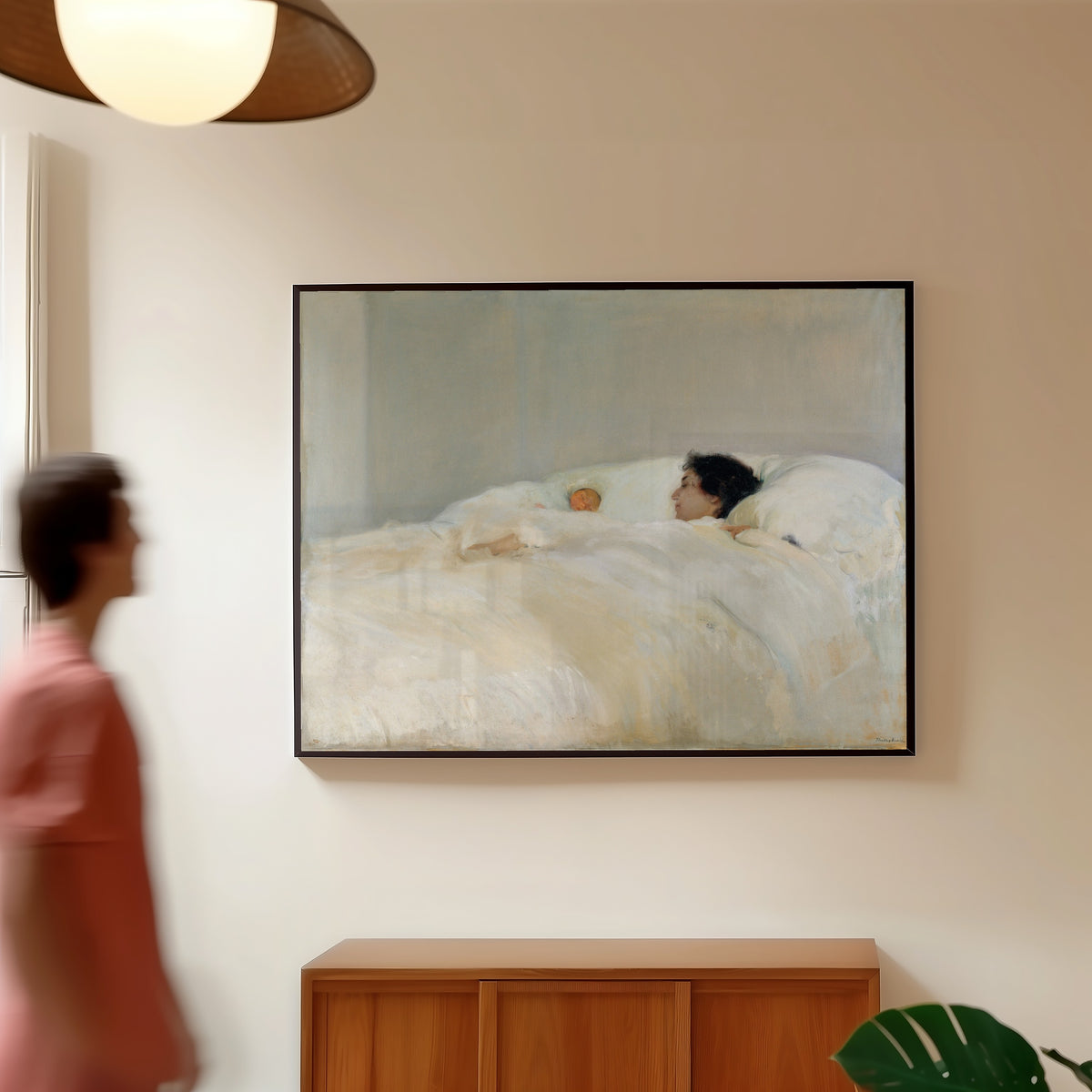 Framed art print of Mother by Joaquín Sorolla, in a slim black frame on a warm wall in a sunlit room
