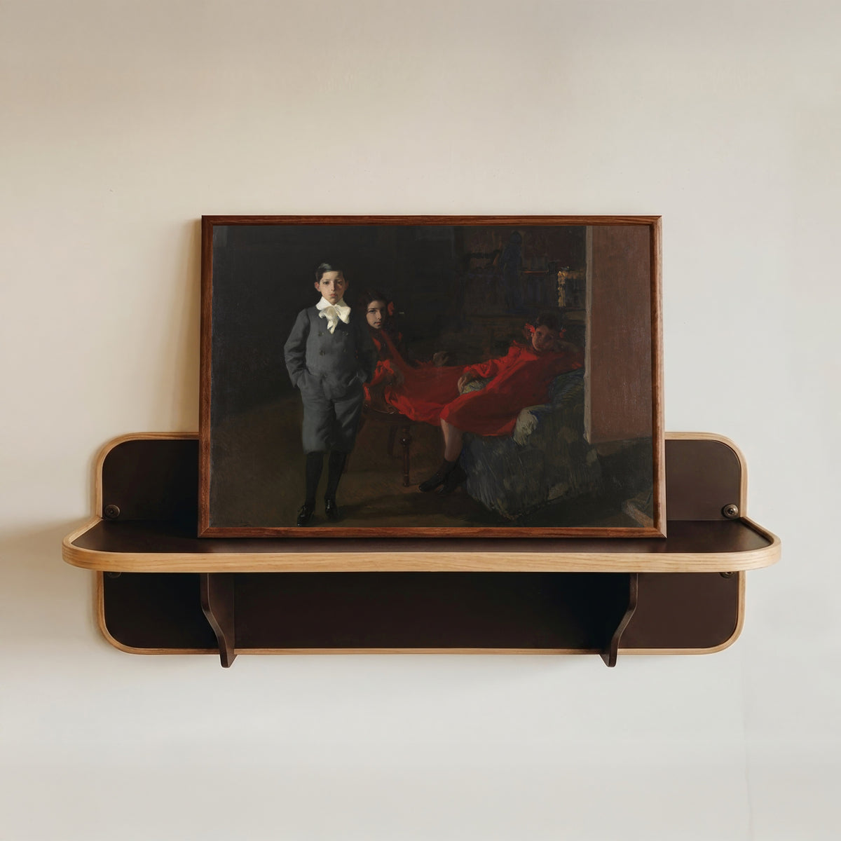 Framed art print of My Children by Joaquín Sorolla, in a dark wood frame resting on a wall shelf