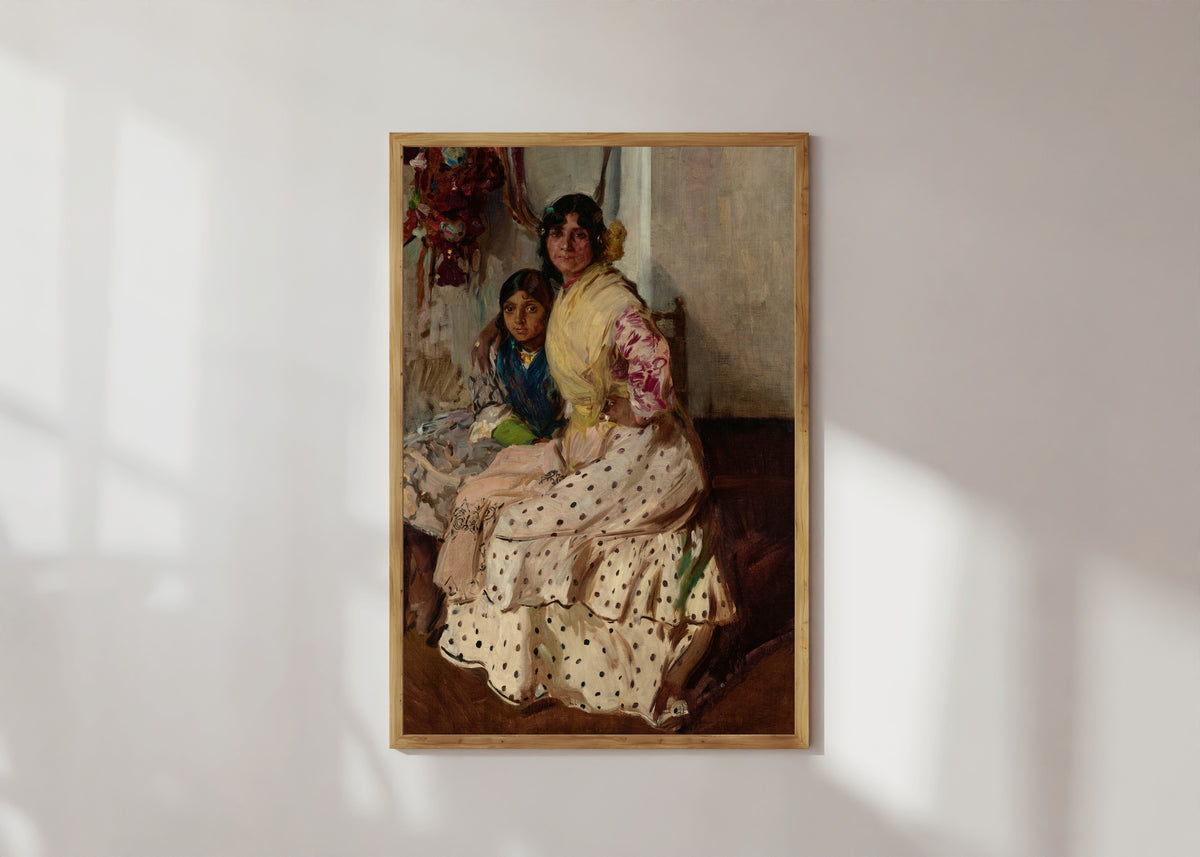 Framed art print of Pepilla the Gypsy and Her Daughter by Joaquín Sorolla, in a light wood frame on a sunlit white wall