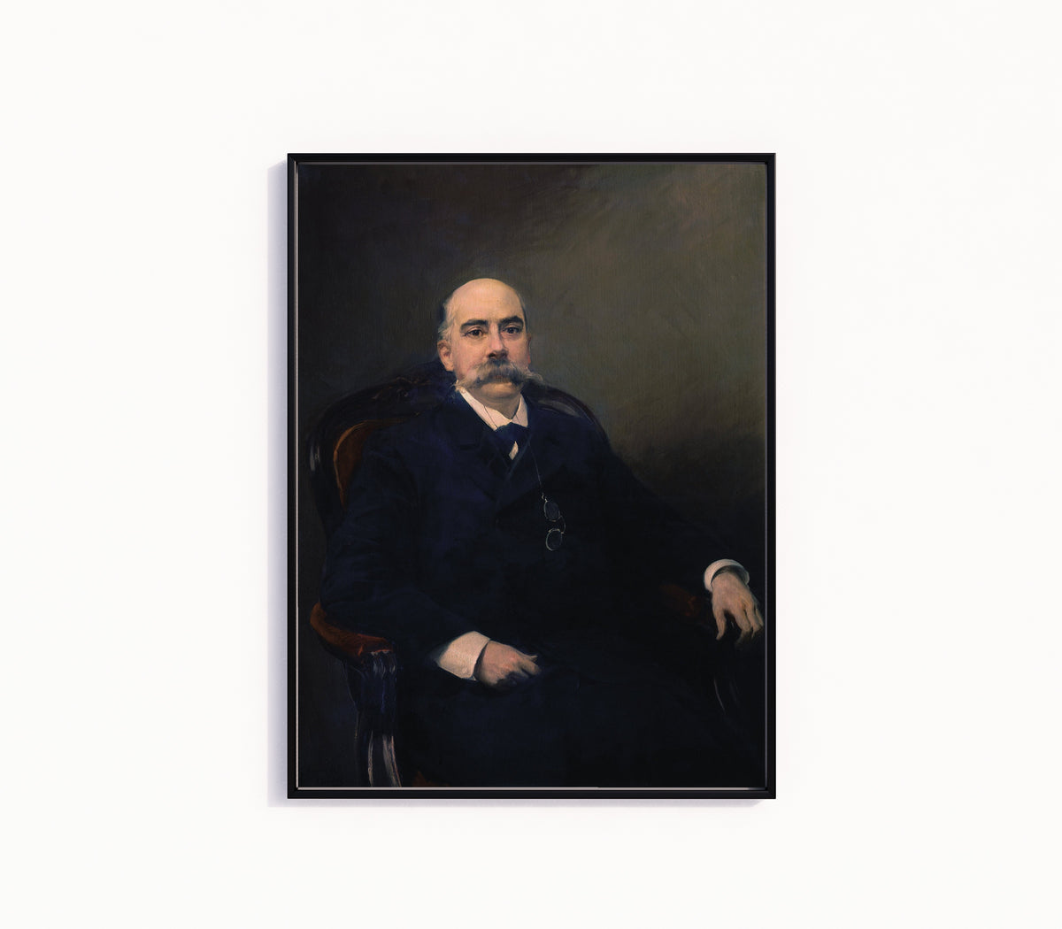 Framed art print of Portrait of Emilio Castelar by Joaquín Sorolla, in a slim black frame on a plain white wall