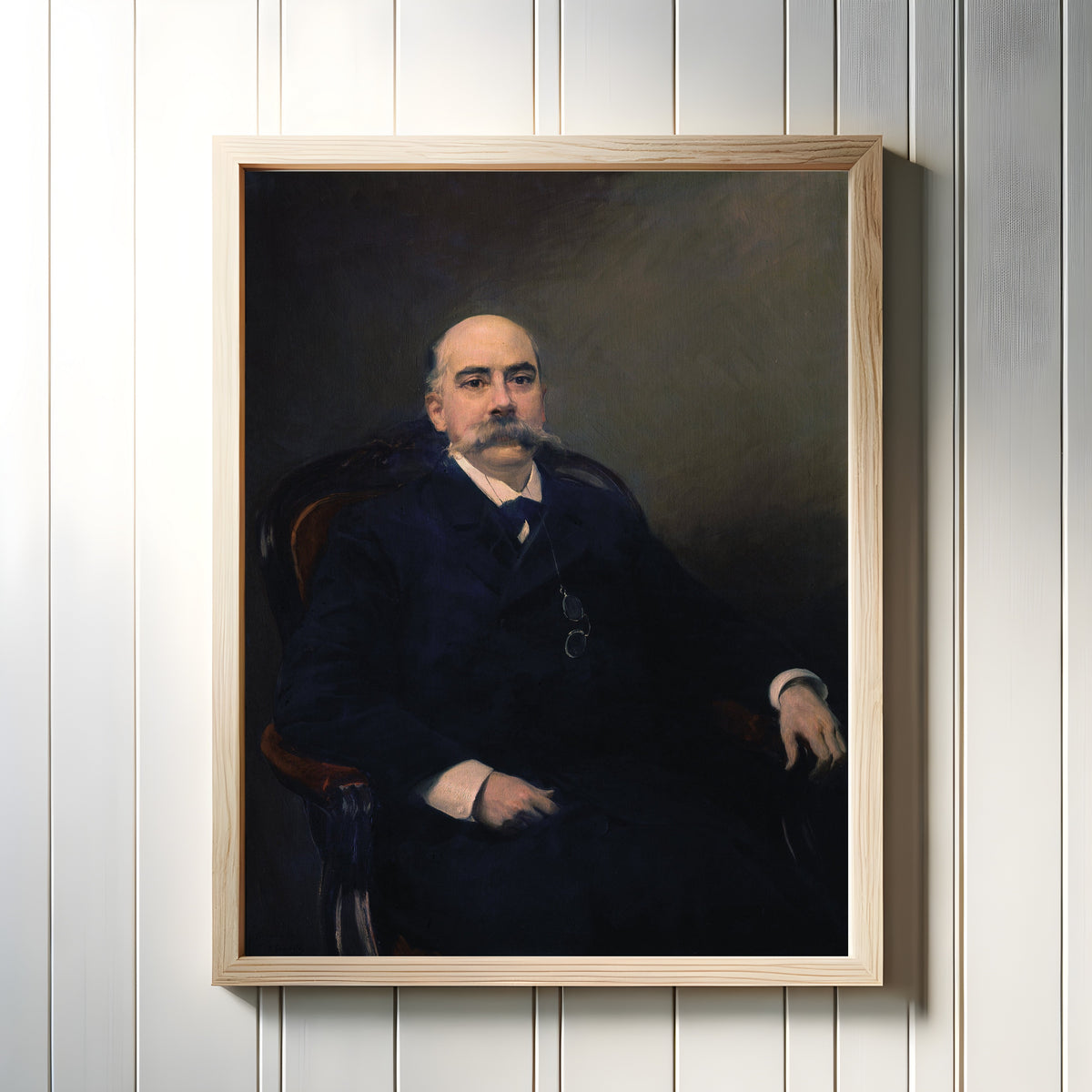 Framed art print of Portrait of Emilio Castelar by Joaquín Sorolla, in a light wood frame on a white panelled wall