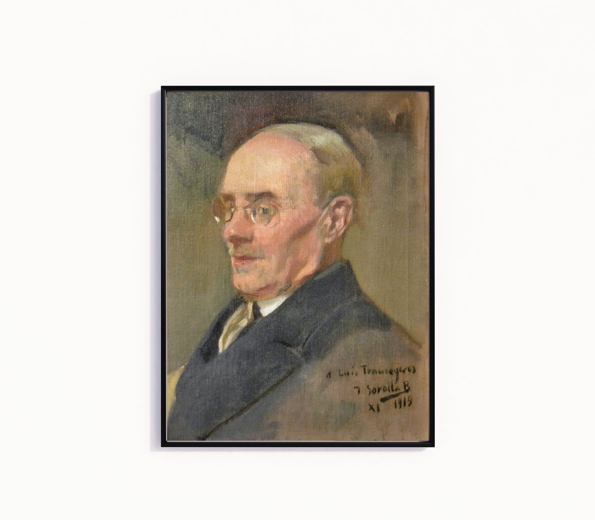 Framed art print of Portrait of Lluís Tramoyeres by Joaquín Sorolla, in a slim black frame on a plain white wall
