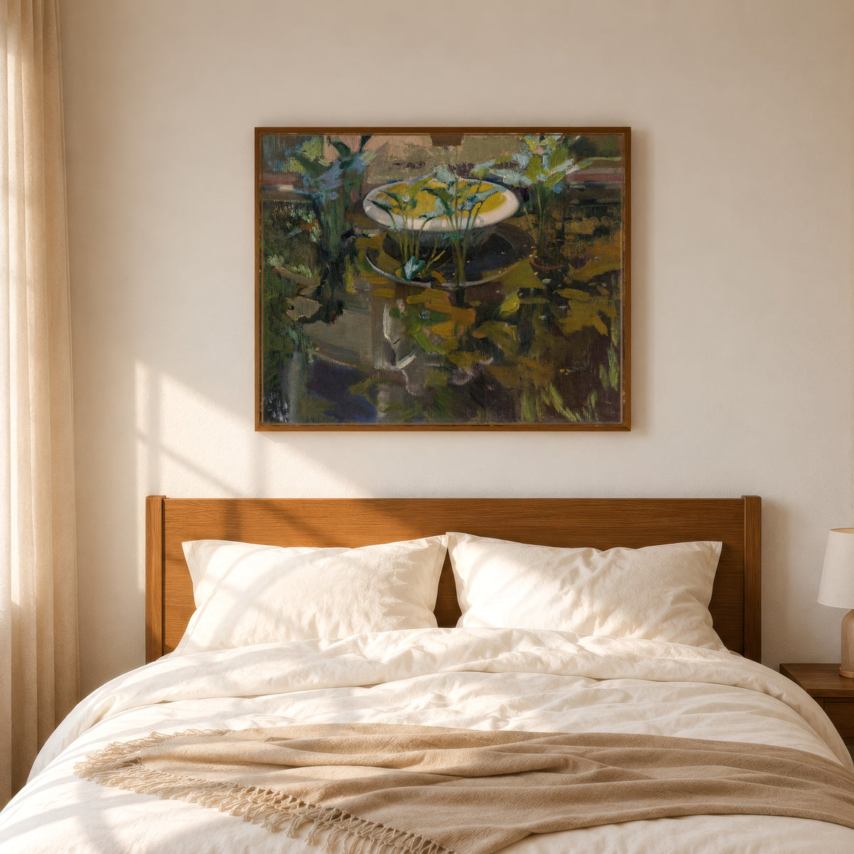 Framed art print of The Fountain of Confidences, Garden of the Sorolla House by Joaquín Sorolla, in a slim wood frame above a bed in a sunlit bedroom