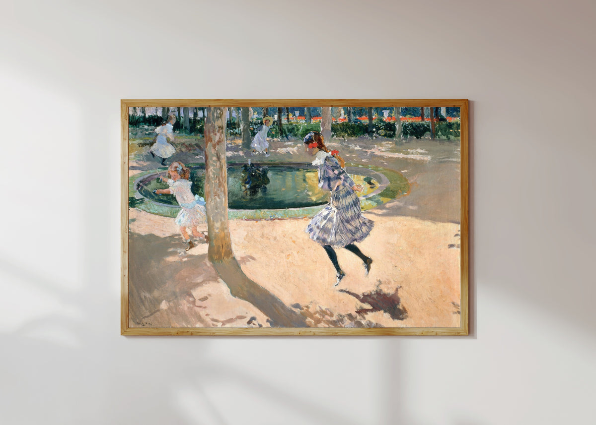 Framed art print of The Skipping Rope by Joaquín Sorolla, in a light wood frame on a sunlit white wall