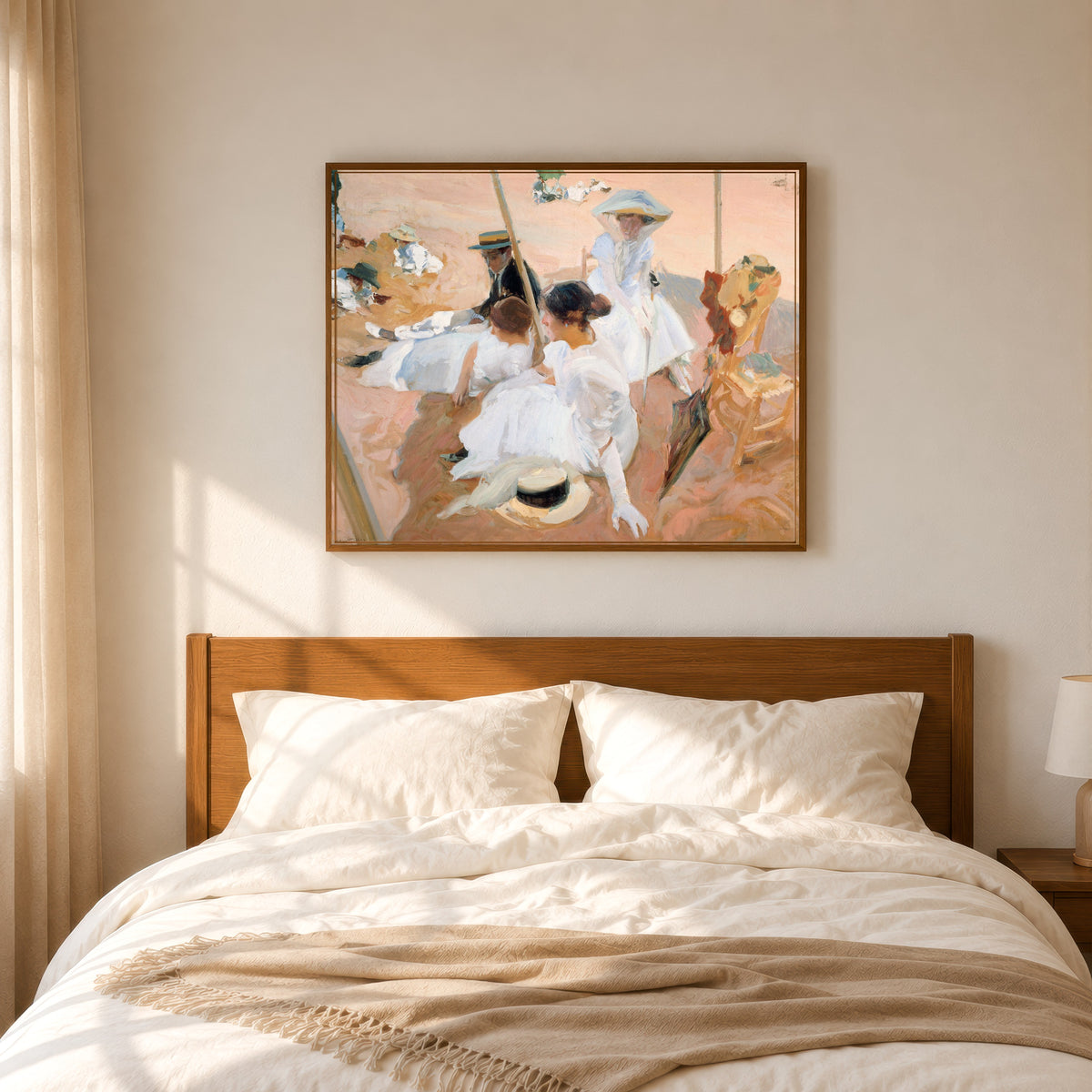 Framed art print of Under the Awning, Zarauz by Joaquín Sorolla, in a slim wood frame above a bed in a sunlit bedroom