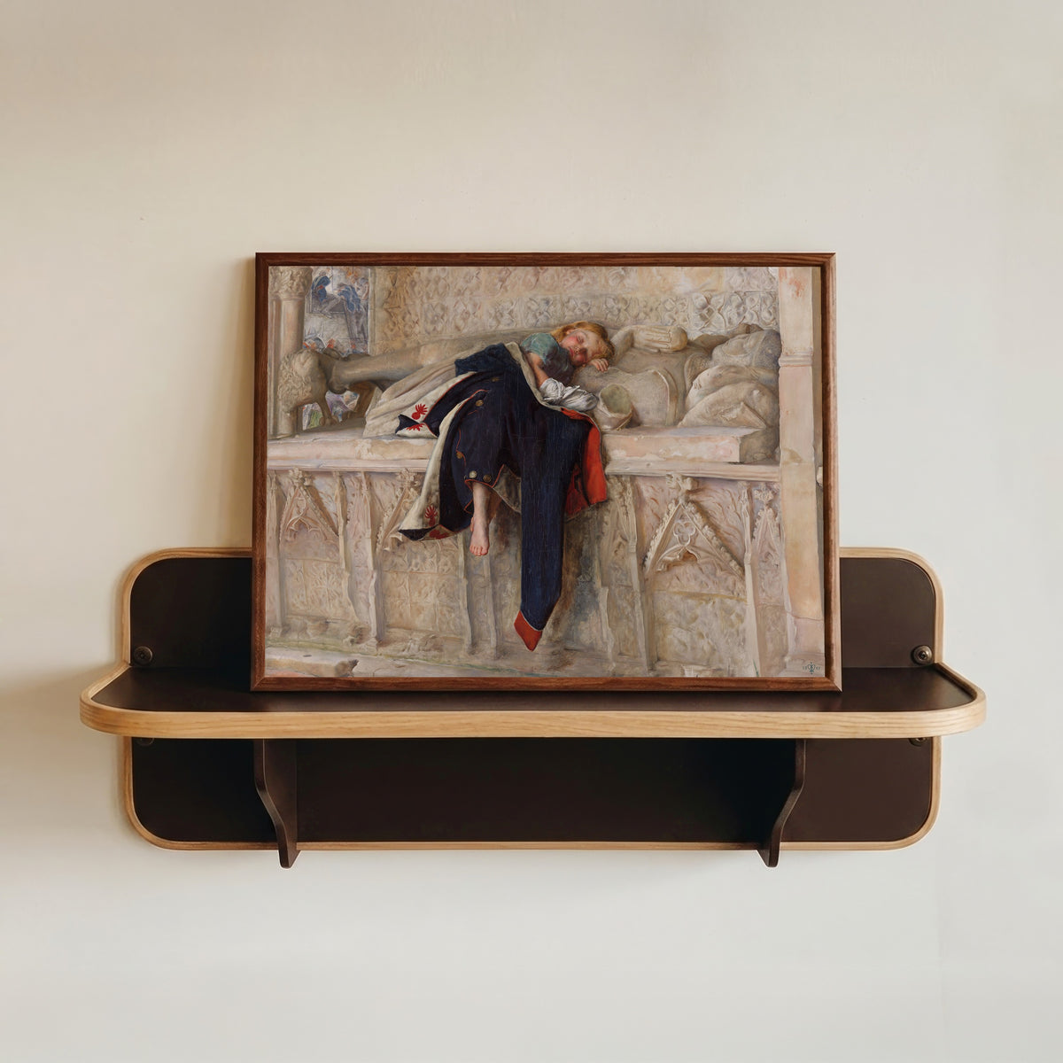 Framed art print of L'Enfant du Régiment by John Everett Millais, in a dark wood frame resting on a wall shelf