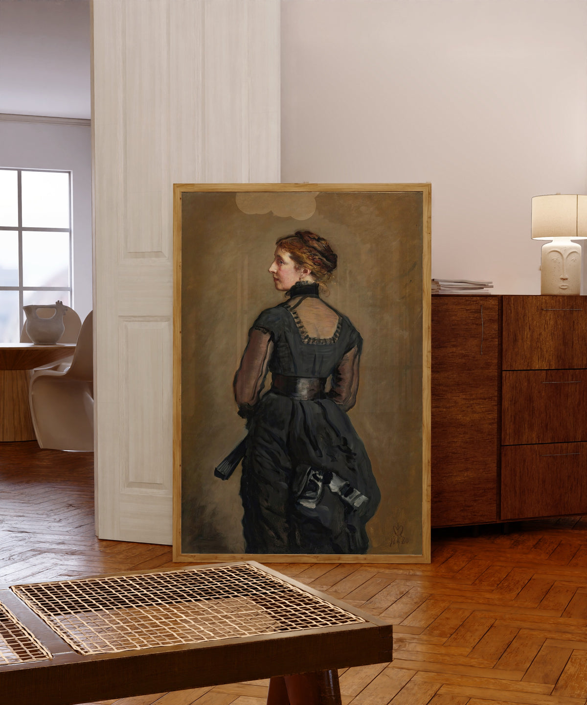Framed art print of Portrait of Kate Perugini, Daughter of Charles… by John Everett Millais, in a light wood frame leaning in a warm room with a parquet floor