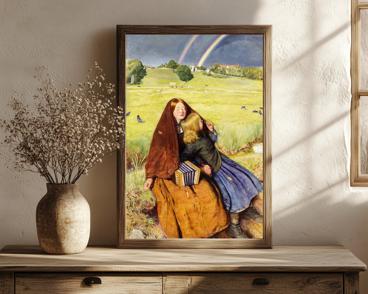 Framed art print of The Blind Girl by John Everett Millais, in a dark wood frame leaning on a rustic console beside dried flowers