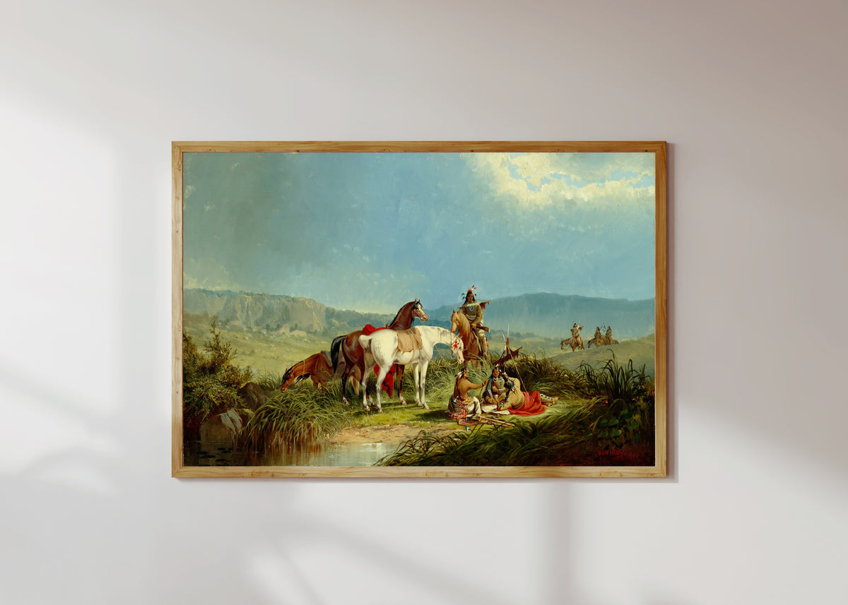 Framed art print of Indians Playing Cards by John Mix Stanley, in a light wood frame on a sunlit white wall