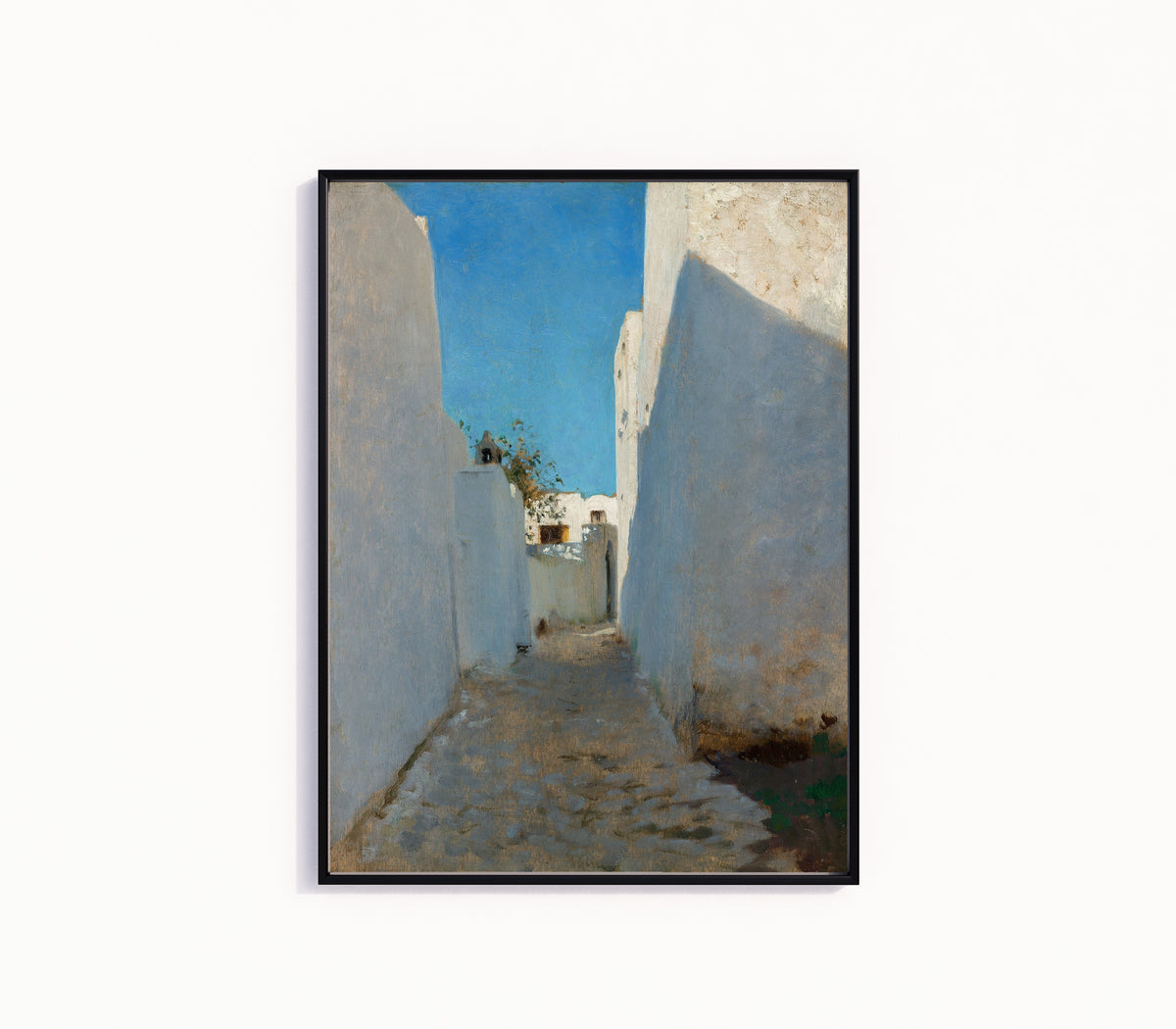 Framed art print of A Moroccan Street Scene by John Singer Sargent, in a slim black frame on a plain white wall