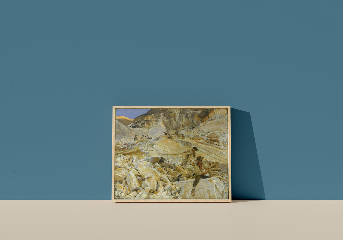 Framed art print of Bringing Down Marble from the Quarries to Carrara by John Singer Sargent, in a light wood frame leaning on a blue wall