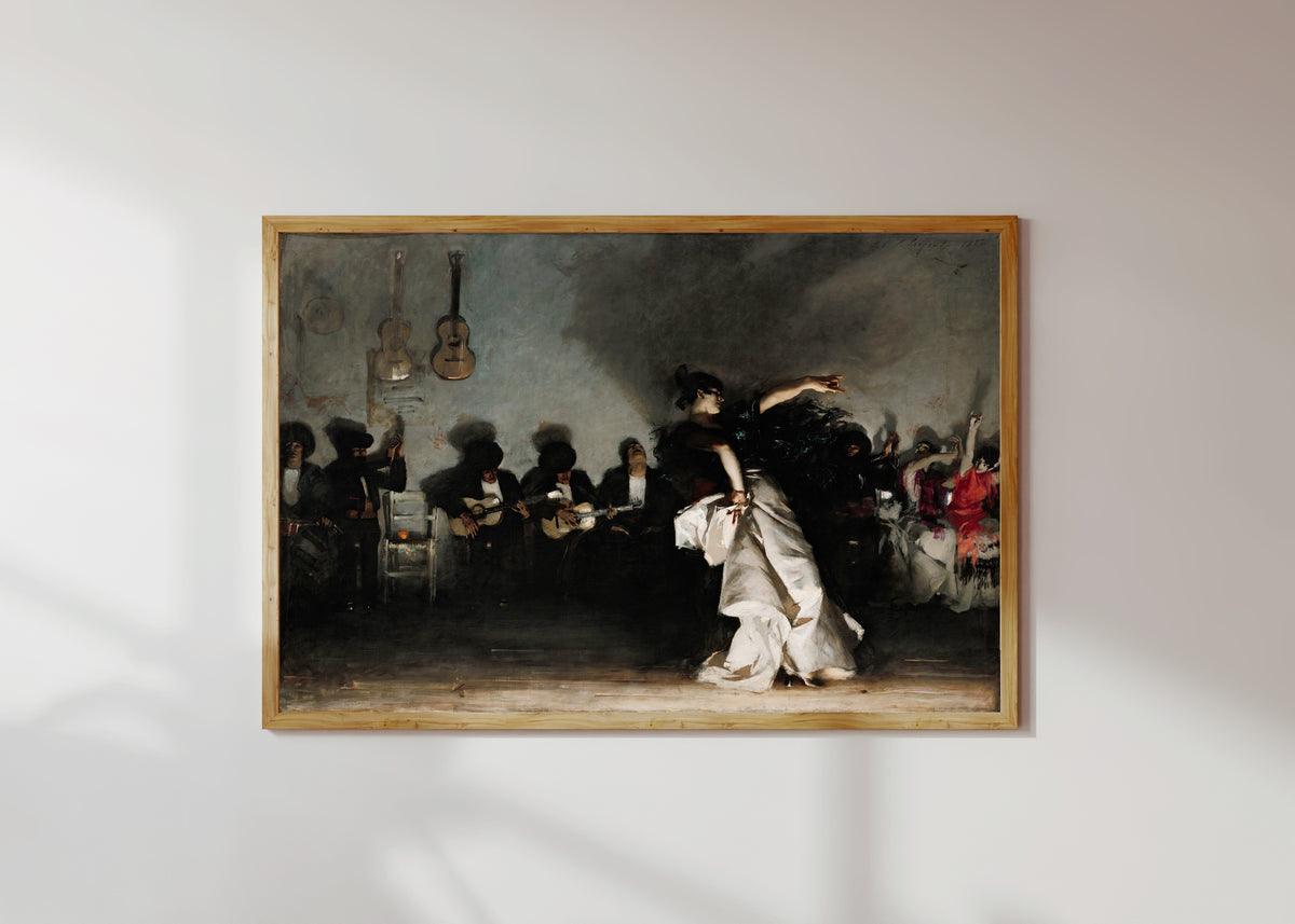 Framed art print of El Jaleo by John Singer Sargent, in a light wood frame on a sunlit white wall