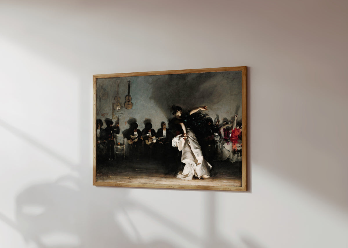 Framed art print of El Jaleo by John Singer Sargent, in a light wood frame on a sunlit white wall, seen at a slight angle