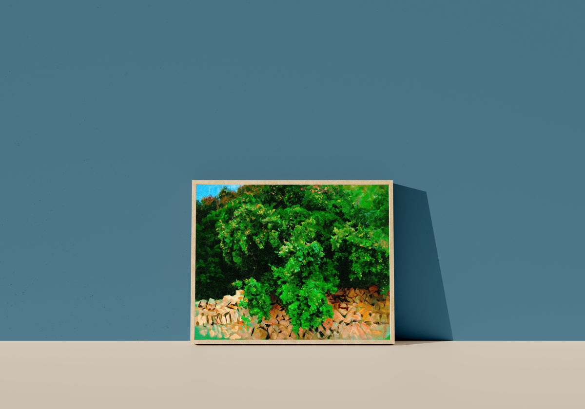 Framed art print of Ilex Wood, Majorca by John Singer Sargent, in a light wood frame leaning on a blue wall