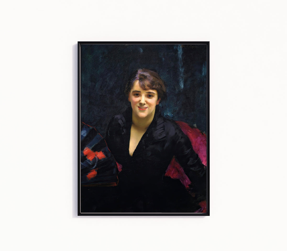 Framed art print of Madame Errázuriz (The Lady in Black) by John Singer Sargent, in a slim black frame on a plain white wall