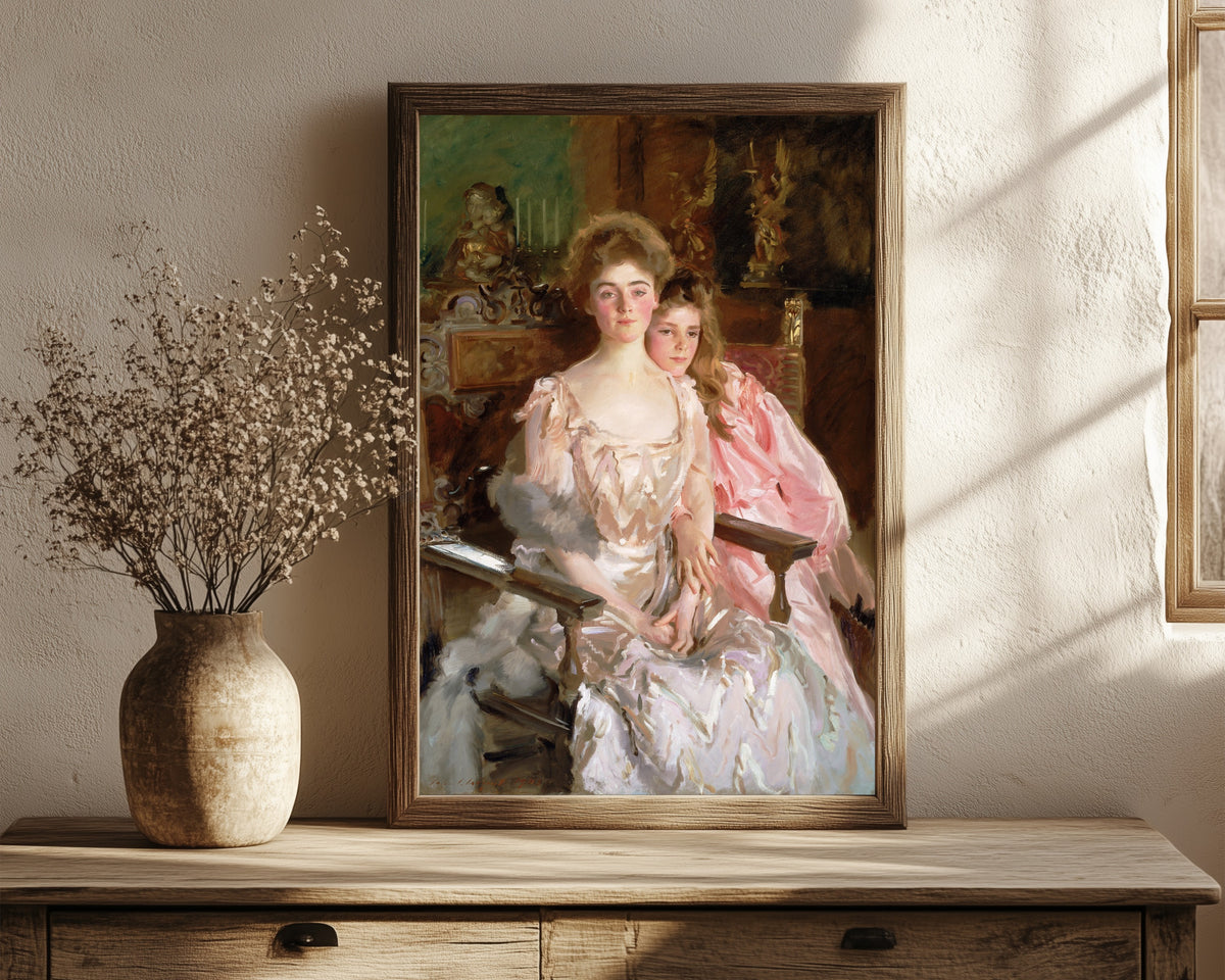 Framed art print of Mrs. Fiske Warren (Gretchen Osgood) and Her… by John Singer Sargent, in a dark wood frame leaning on a rustic console beside dried flowers