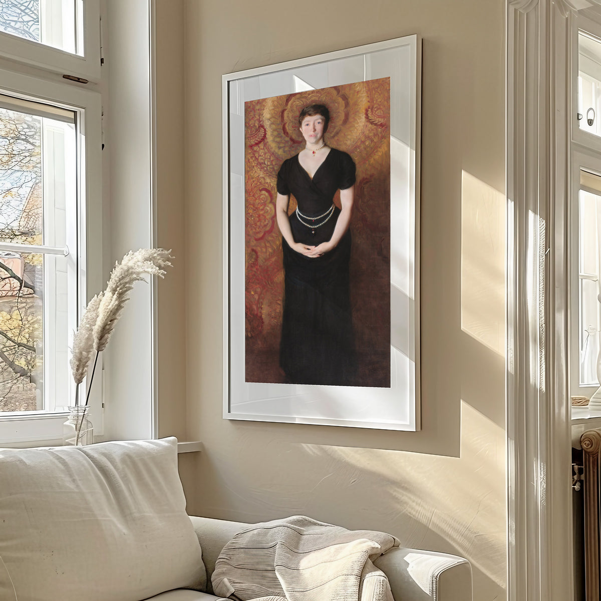 Framed art print of Portrait of Isabella Stewart Gardner by John Singer Sargent, in a sunlit living room above a sofa