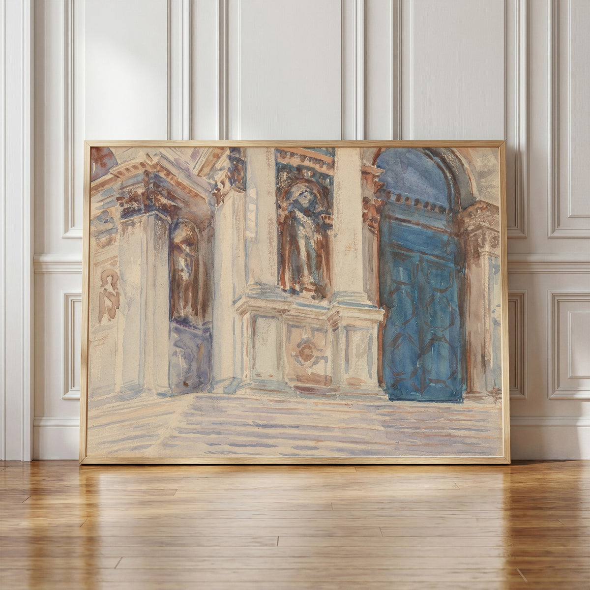 Framed art print of Santa Maria della Salute, Venice by John Singer Sargent, in a light wood frame leaning against a panelled white wall