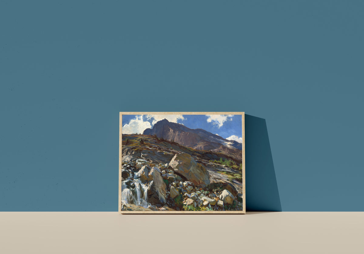 Framed art print of Simplon Pass by John Singer Sargent, in a light wood frame leaning on a blue wall