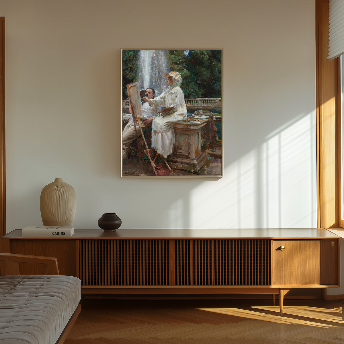 Framed art print of The Fountain, Villa Torlonia, Frascati by John Singer Sargent, in a thin light frame on a sunlit wall above a wooden sideboard