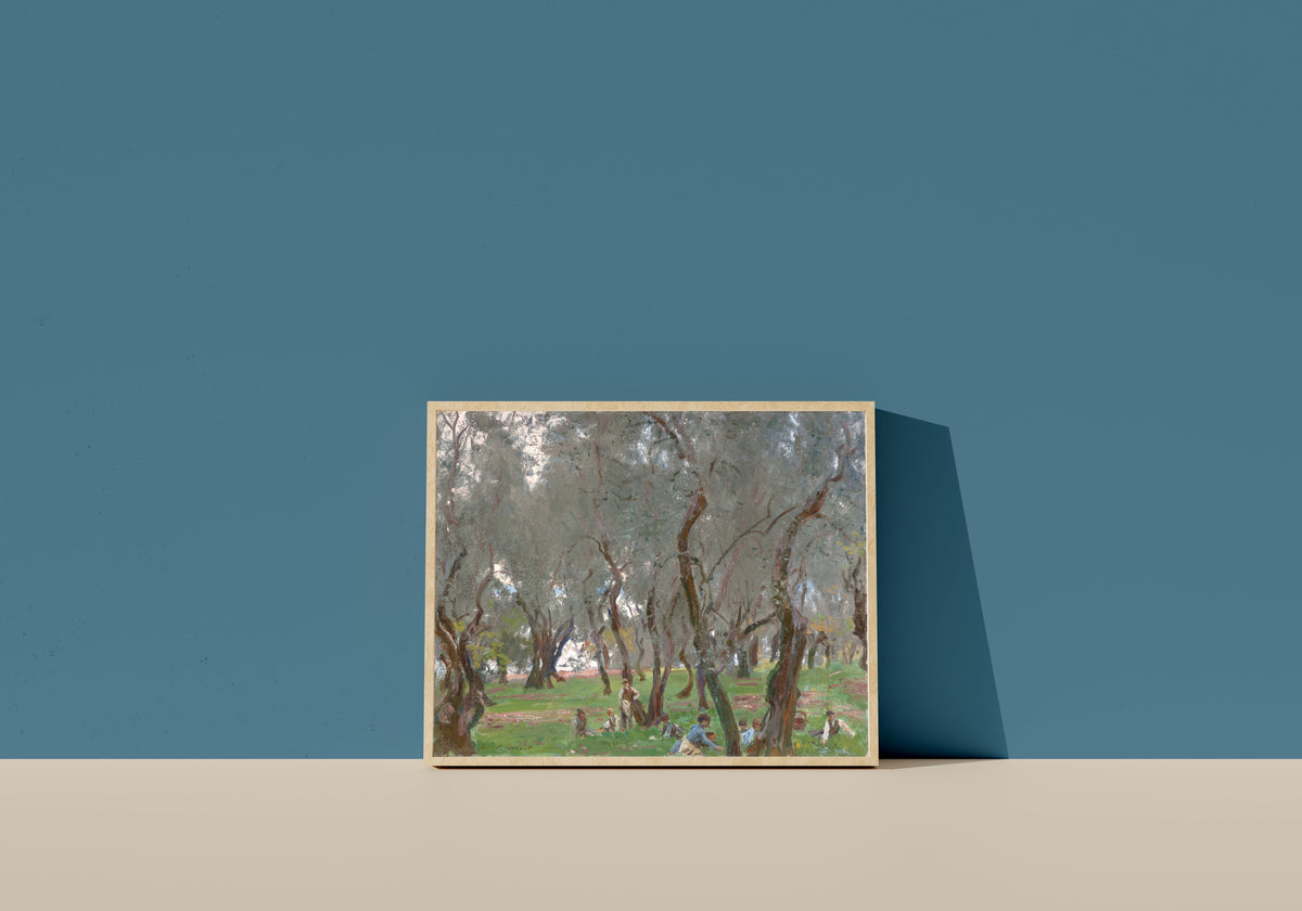 Framed art print of The Olive Grove by John Singer Sargent, in a light wood frame leaning on a blue wall