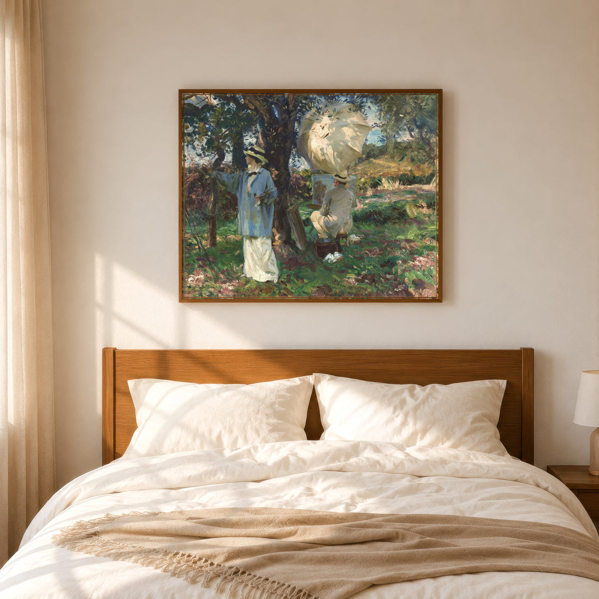 Framed art print of The Sketchers by John Singer Sargent, in a slim wood frame above a bed in a sunlit bedroom