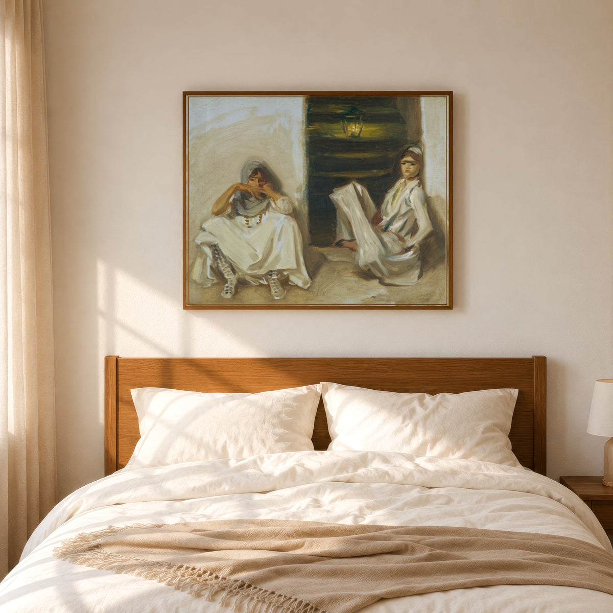 Framed art print of Two Arab Women by John Singer Sargent, in a slim wood frame above a bed in a sunlit bedroom