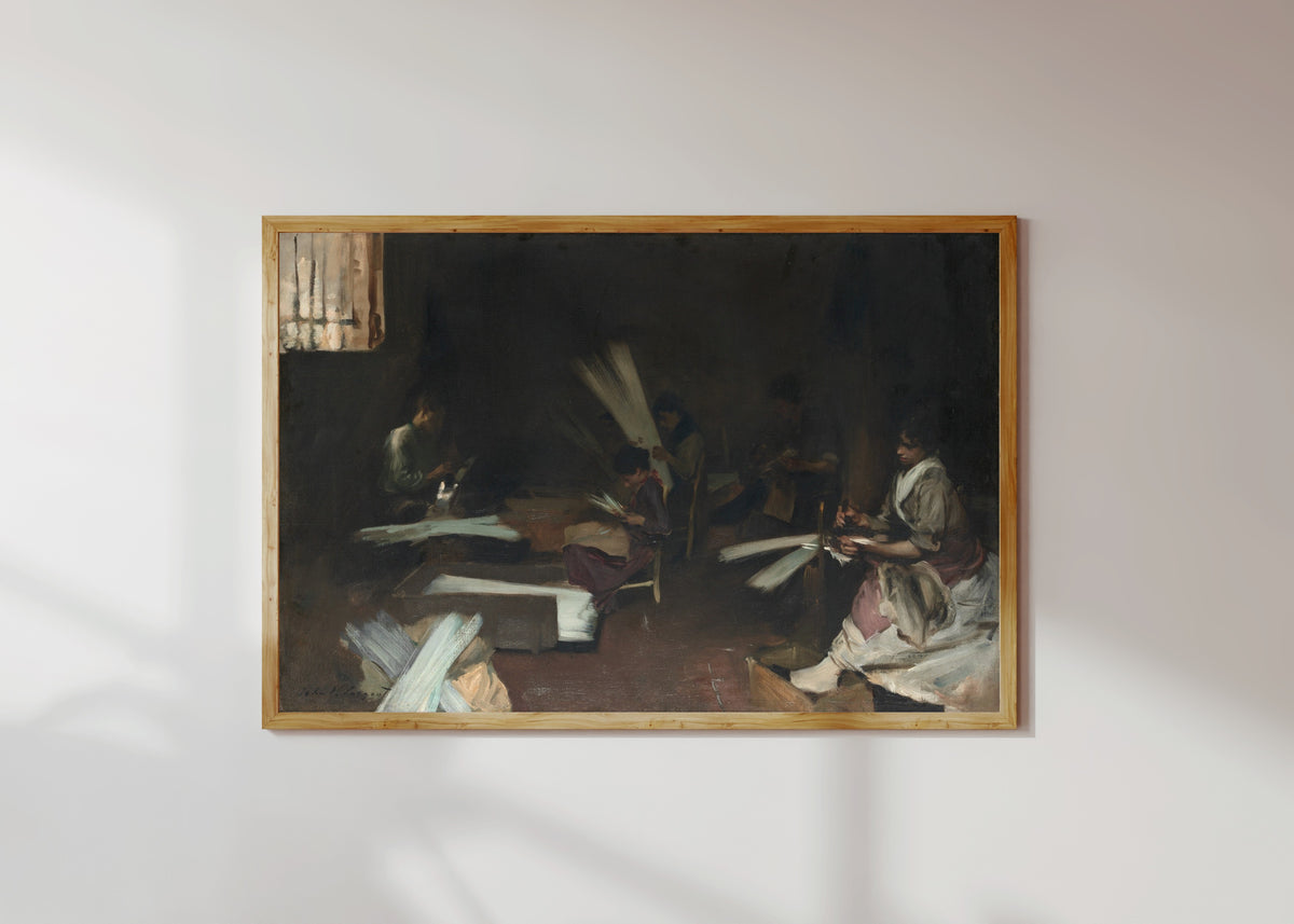 Framed art print of Venetian Glass Workers by John Singer Sargent, in a light wood frame on a sunlit white wall