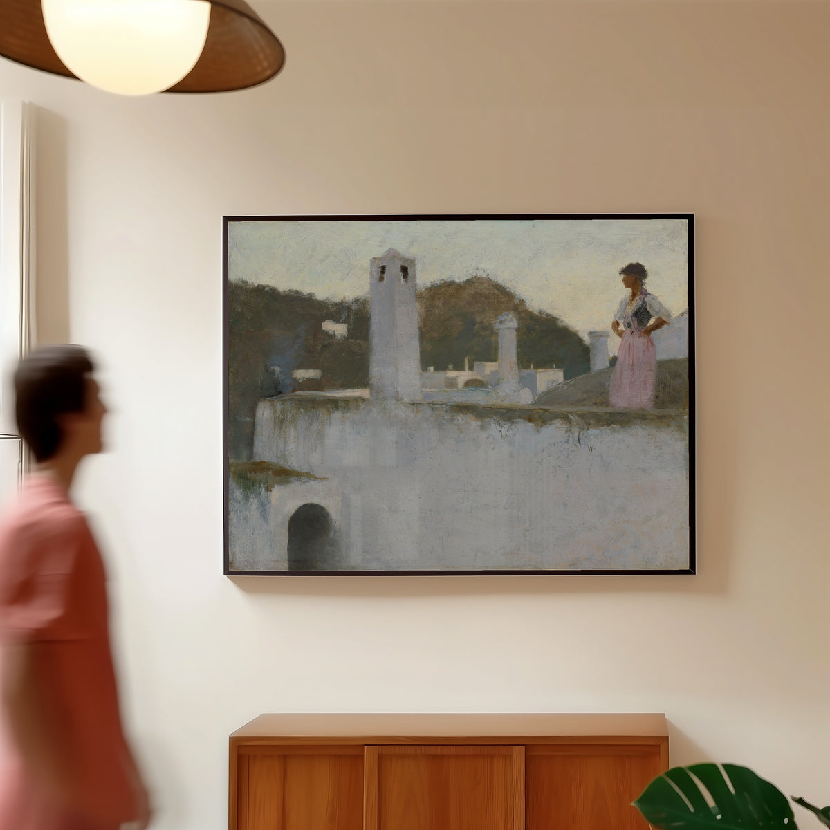 Framed art print of View of Capri by John Singer Sargent, in a slim black frame on a warm wall in a sunlit room