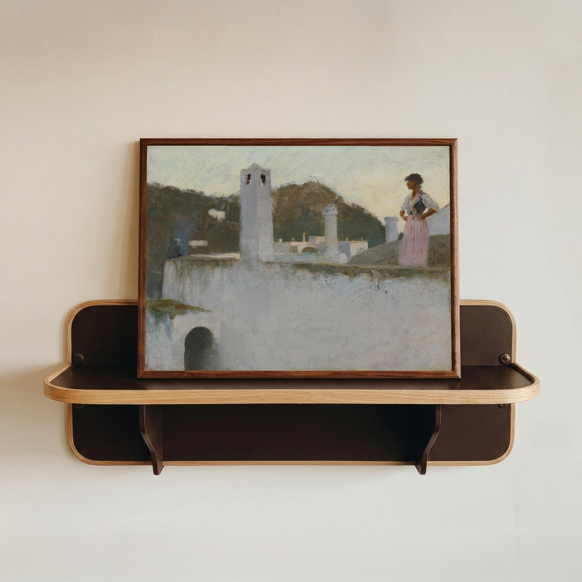 Framed art print of View of Capri by John Singer Sargent, in a dark wood frame resting on a wall shelf