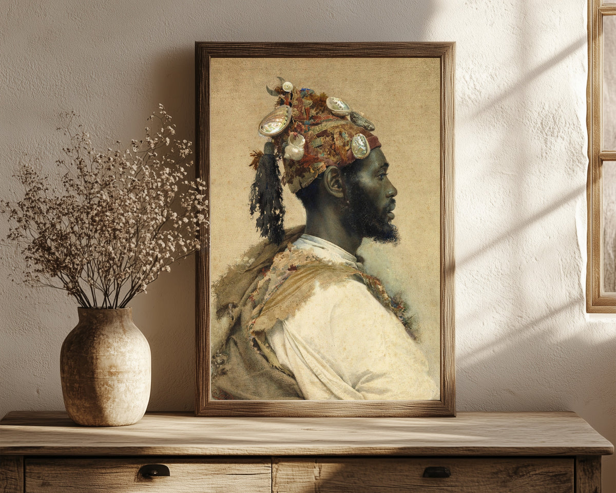 Framed art print of Moorish Man 2 by Josep Tapiró Baró, in a dark wood frame leaning on a rustic console beside dried flowers