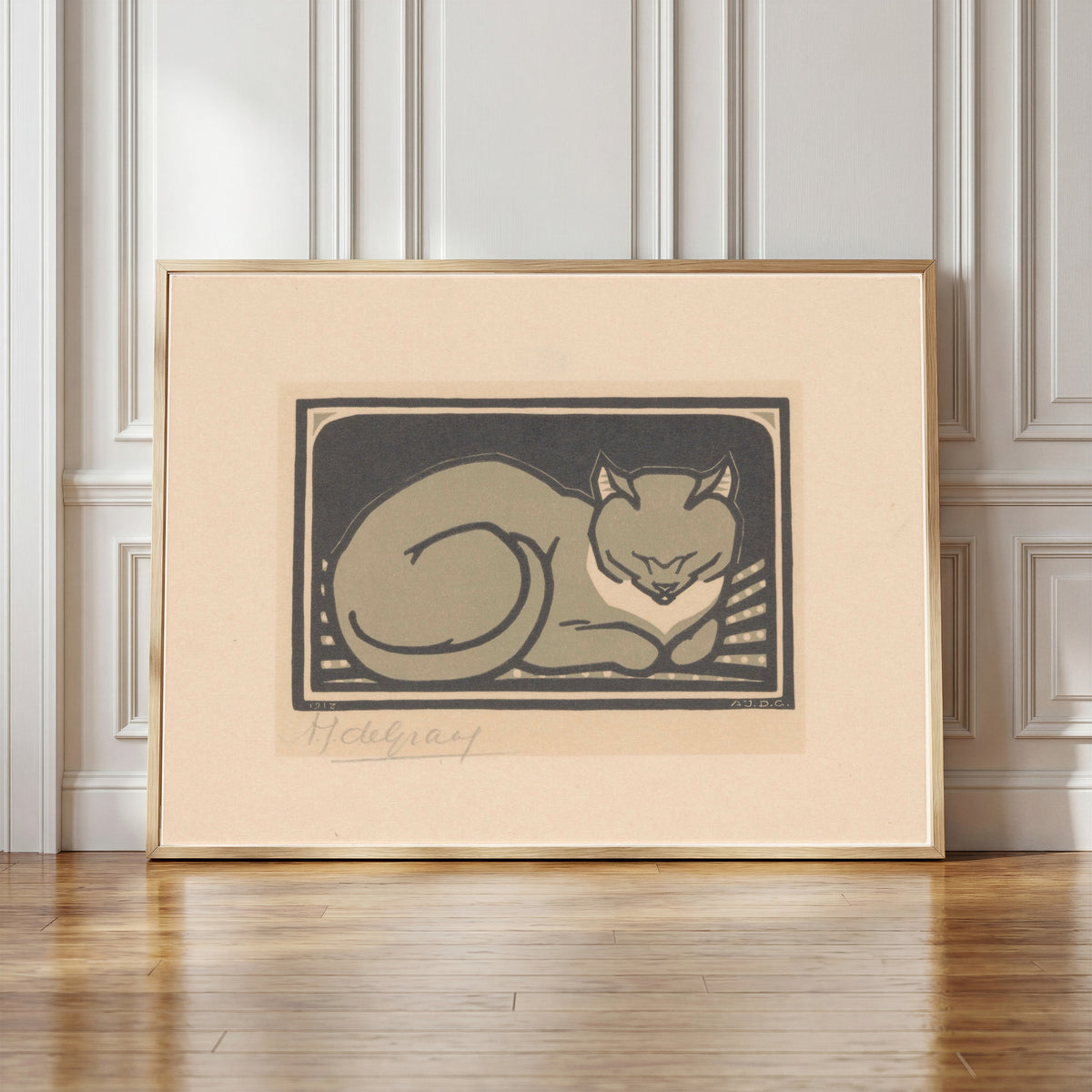 Framed art print of Sleeping Cat by Julie de Graag, in a light wood frame leaning against a panelled white wall