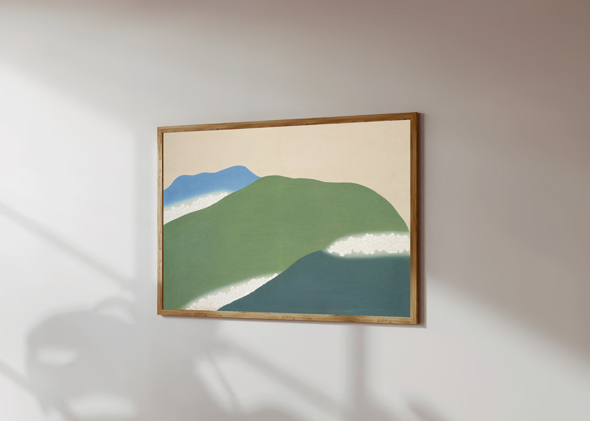 Framed art print of Green mountains, from Momoyogusa by Kamisaka Sekka, in a light wood frame on a sunlit white wall, seen at a slight angle