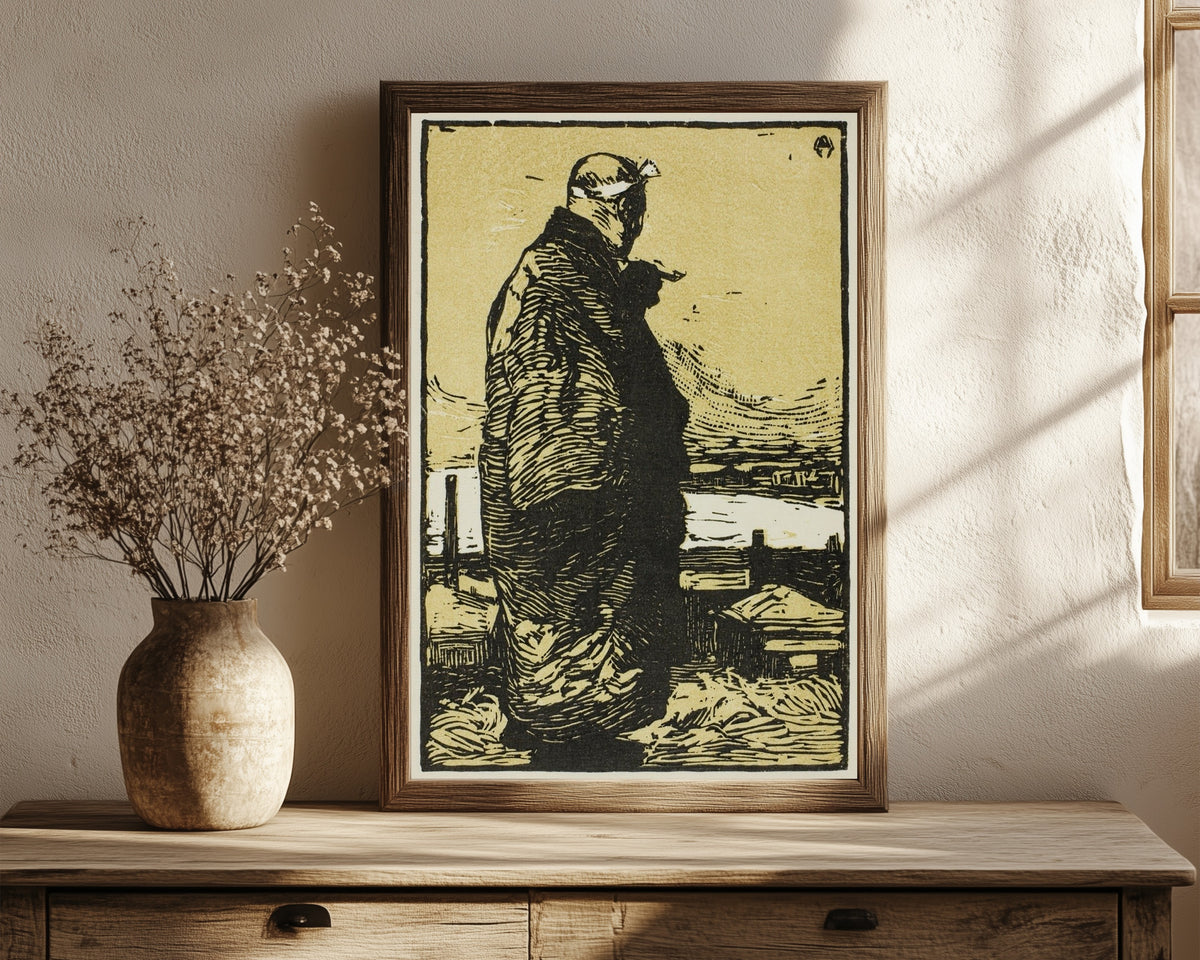 Framed art print of The Fisherman by Kanae Yamamoto, in a dark wood frame leaning on a rustic console beside dried flowers