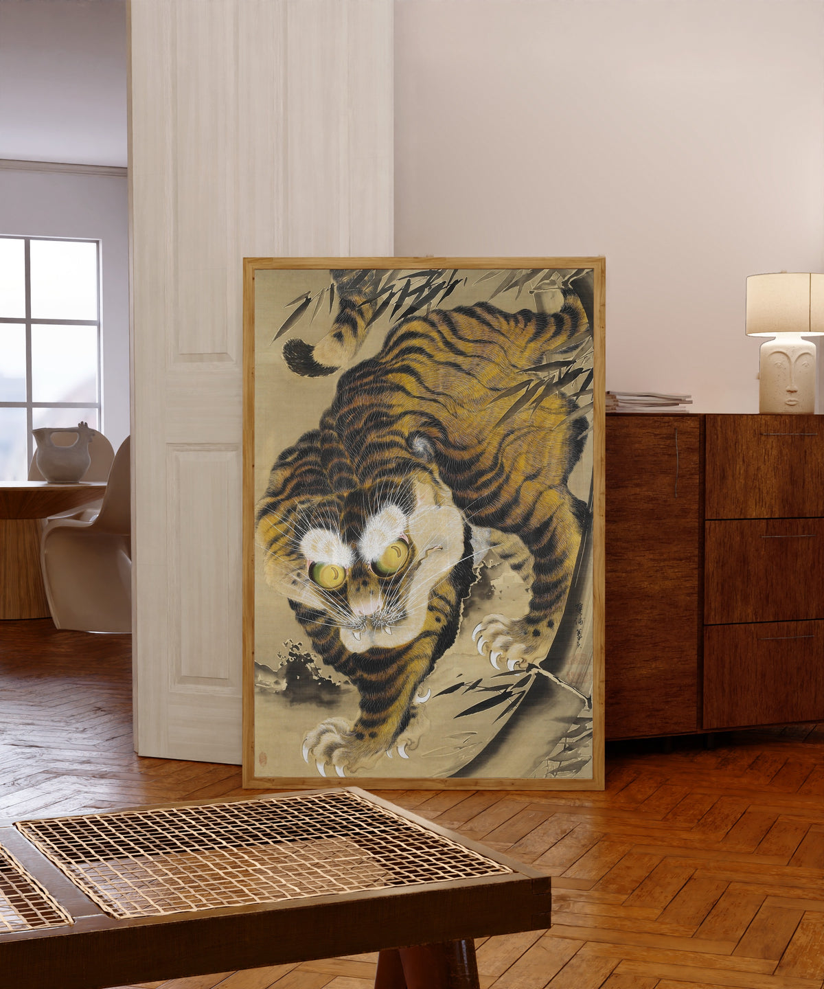 Framed art print of Tiger by Katayama Yokoku, in a light wood frame leaning in a warm room with a parquet floor