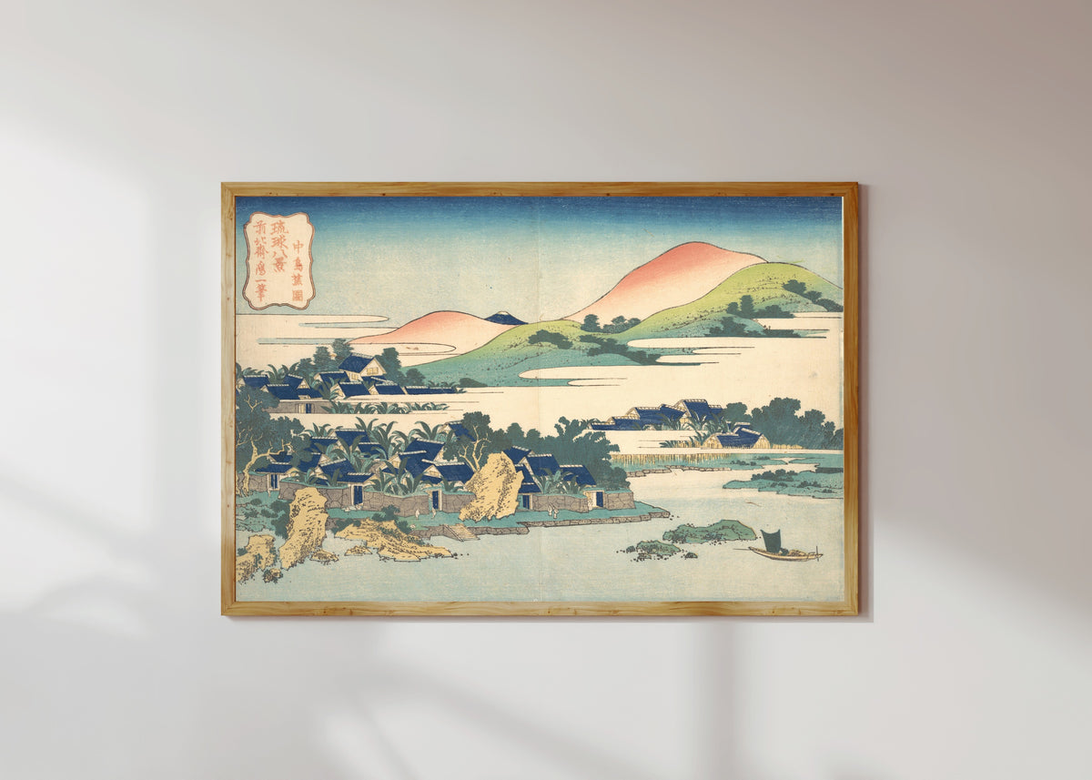 Framed art print of Eight Views of the Ryūkyū Islands: Banana Garden at Nakashima by Katsushika Hokusai, in a light wood frame on a sunlit white wall