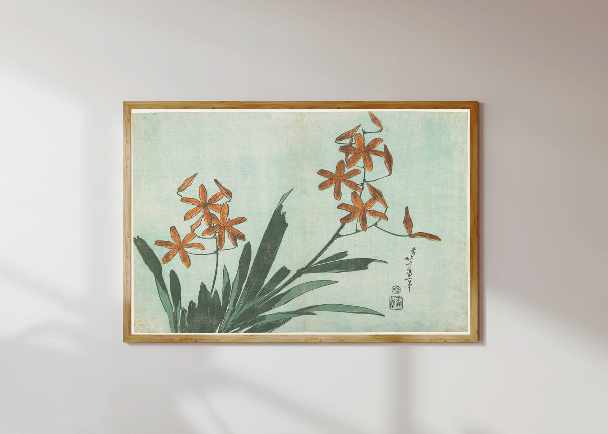 Framed art print of Large Flowers: Leopard Lily by Katsushika Hokusai, in a light wood frame on a sunlit white wall