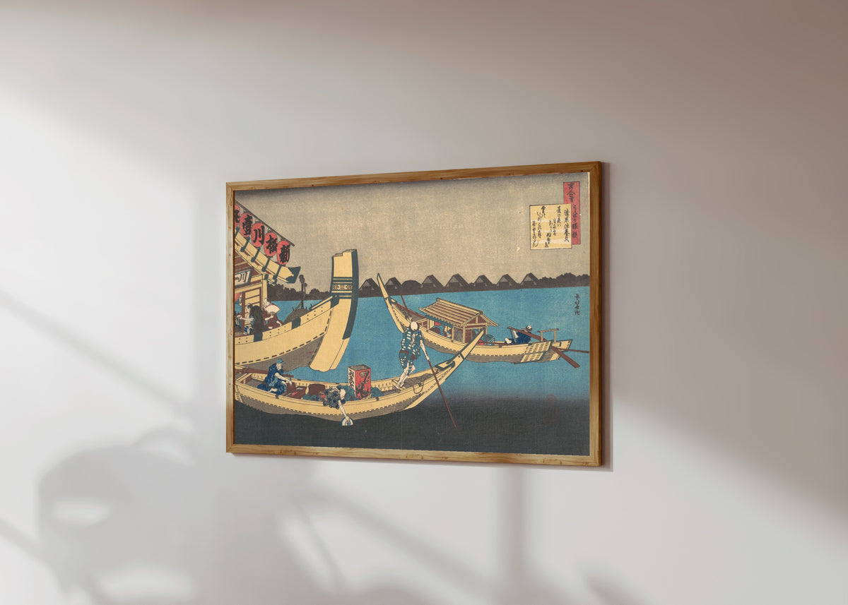 Framed art print of One Hundred Poems Explained by the Nurse: Poem… by Katsushika Hokusai, in a light wood frame on a sunlit white wall, seen at a slight angle