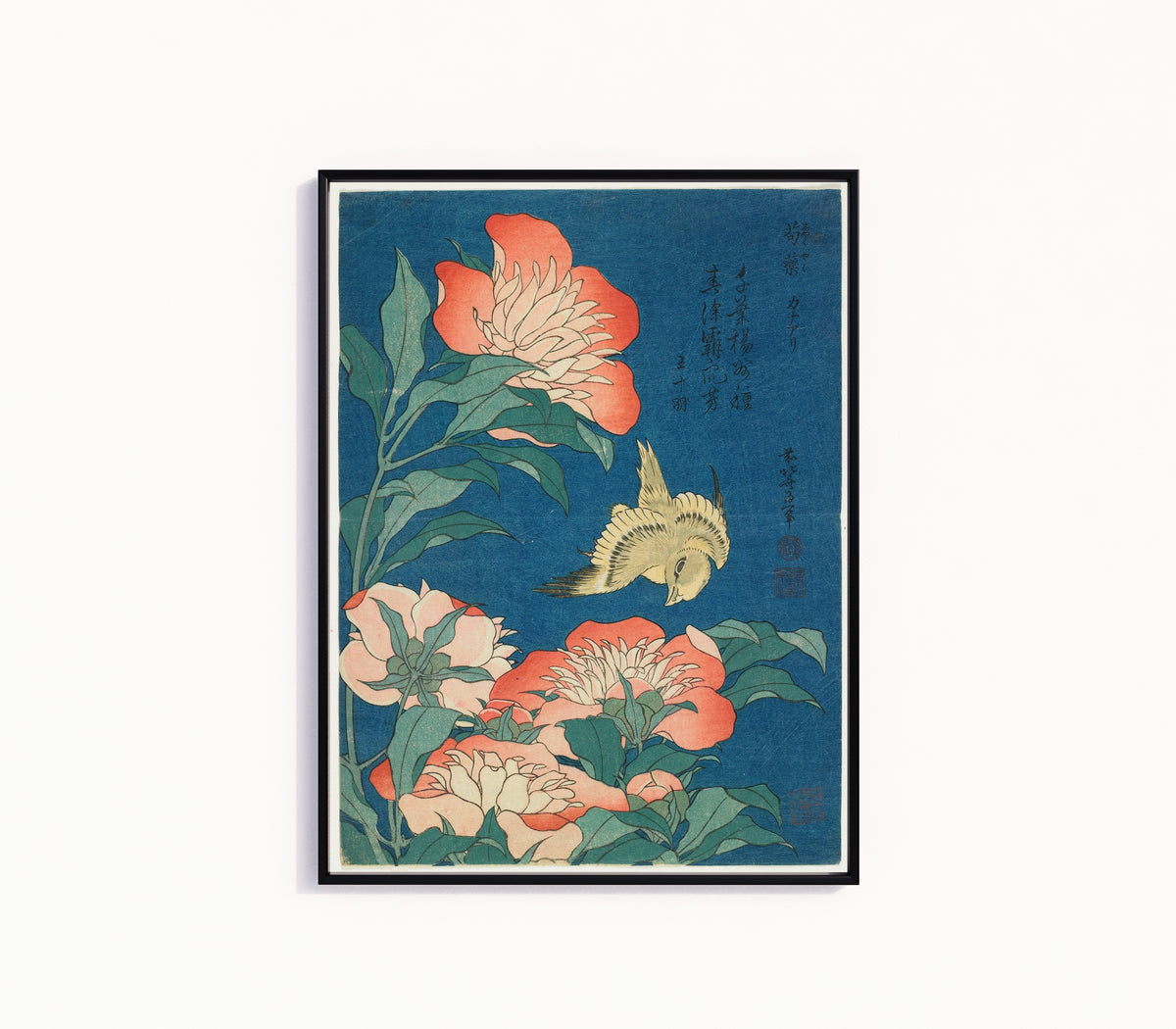 Framed art print of Peonies and Canary by Katsushika Hokusai, in a slim black frame on a plain white wall