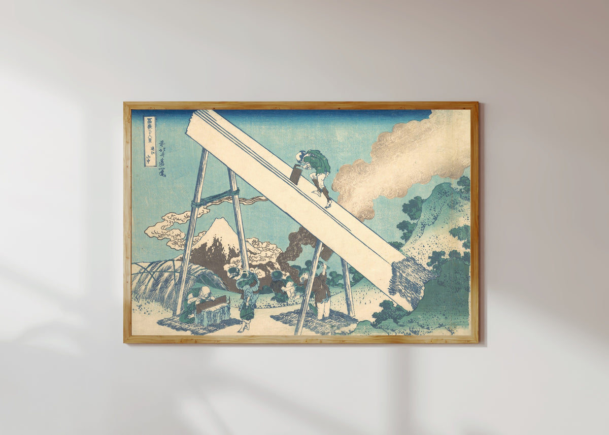Framed art print of Thirty-six Views of Mount Fuji: In the Mountains of Tōtomi Province by Katsushika Hokusai, in a light wood frame on a sunlit white wall