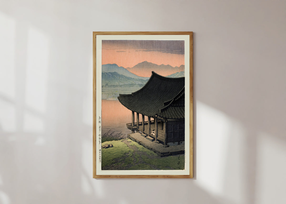 Framed art print of Imhae Pavillion by Kawase Hasui, in a light wood frame on a sunlit white wall