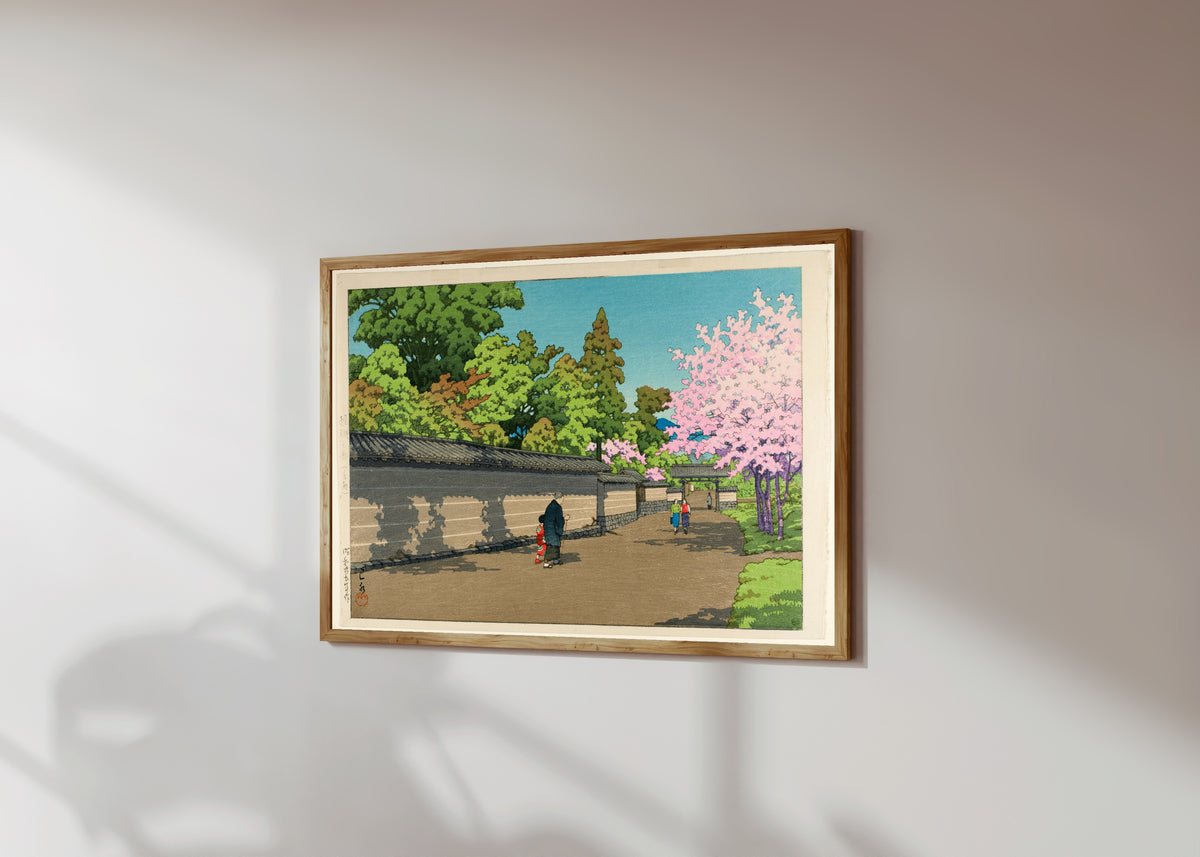 Framed art print of Spring at Daigo, Kyoto by Kawase Hasui, in a light wood frame on a sunlit white wall, seen at a slight angle