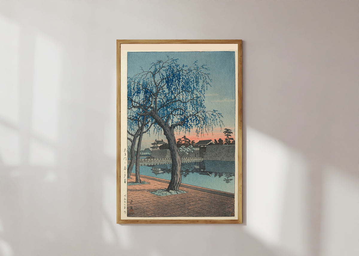 Framed art print of Spring Evening at Otemon Gate by Kawase Hasui, in a light wood frame on a sunlit white wall