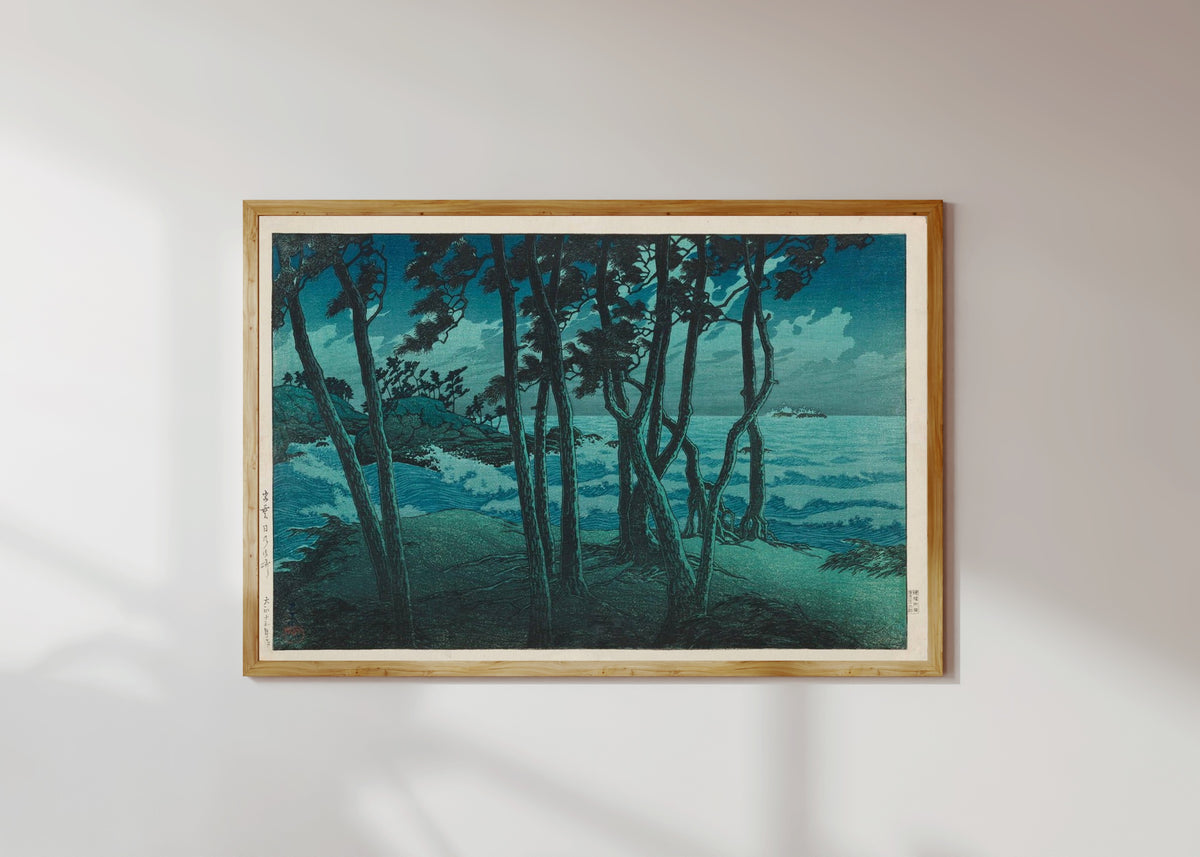 Framed art print of Izumo Seafront by Kawase Hasui, in a light wood frame on a sunlit white wall