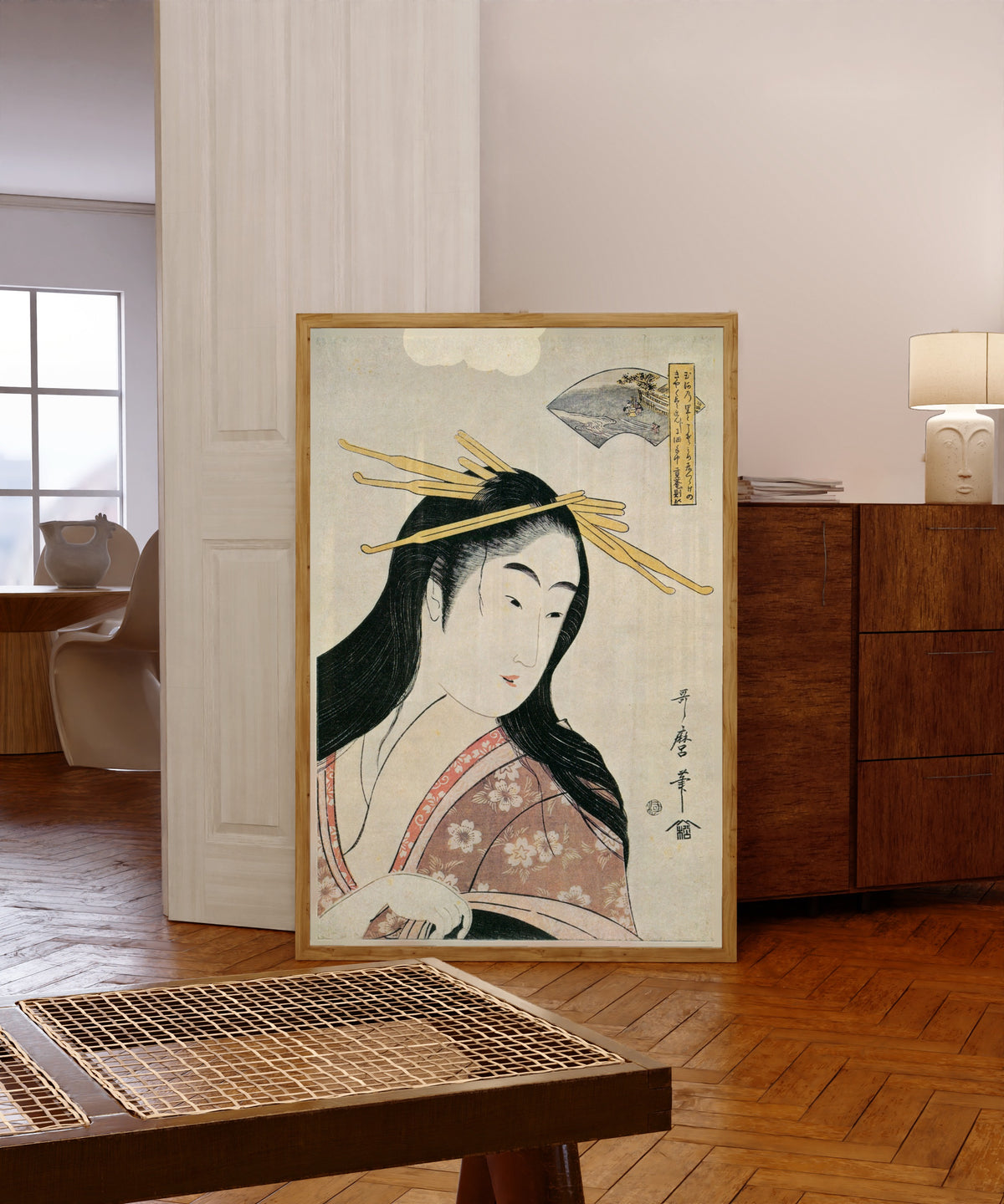 Framed art print of Chofu Jewel River, from Six Jewel Rivers by Kitagawa Utamaro, in a light wood frame leaning in a warm room with a parquet floor