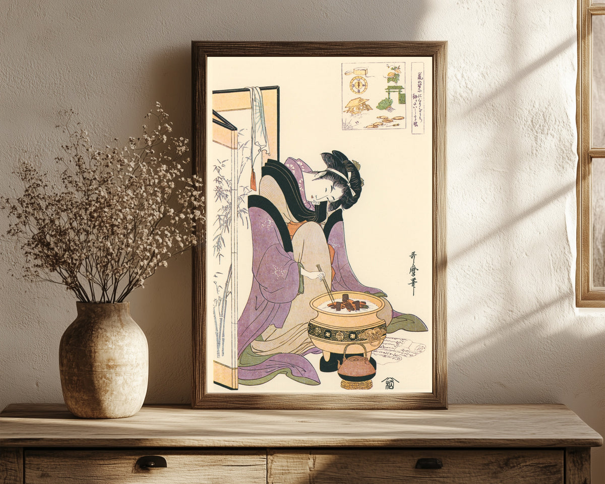 Framed art print of Okita of Naniwaya, before a Brazier by Kitagawa Utamaro, in a dark wood frame leaning on a rustic console beside dried flowers