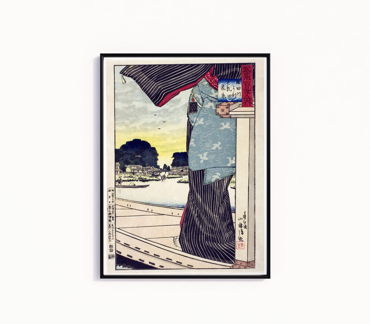 Framed art print of Sumida River by Kobayashi Kiyochika, in a slim black frame on a plain white wall