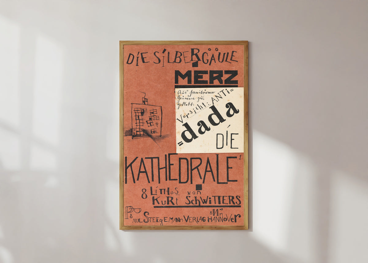 Framed art print of Die Kathedrale (Die Silbergäule) by Kurt Schwitters, in a light wood frame on a sunlit white wall