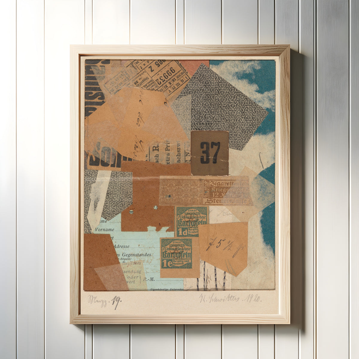 Framed art print of Merzz. 19 by Kurt Schwitters, in a light wood frame on a white panelled wall